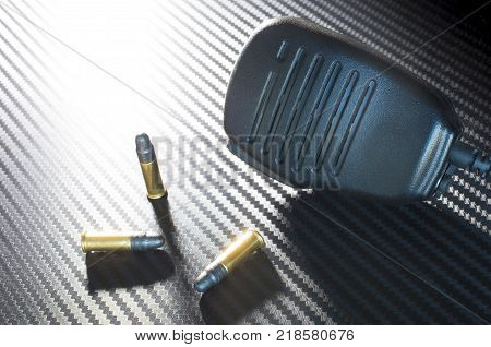 Emergency radio microphone with three rim fire bullets