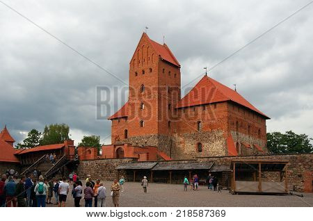 Trakai Lithuania - August 13 2017: Inner yard of Trakai castle and tourists. View of Ducal Palace and its donjon.