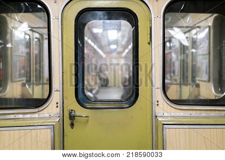 Old metro car, the door of the transition between the subway cars, underground public transport