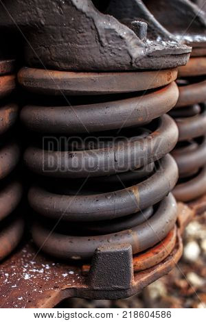 Rusty springs of railway industrial carriage. railstation