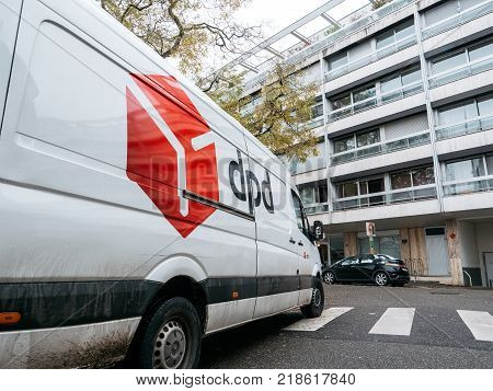 STRASBOURG FRANCE - DEC 4 2017: DPD postal courier van distributing parcels in residential district neighborhood parked on a French street