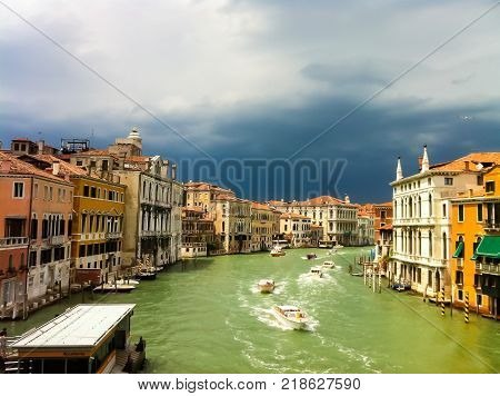 venezia grand canal with sunny and dark cloud
