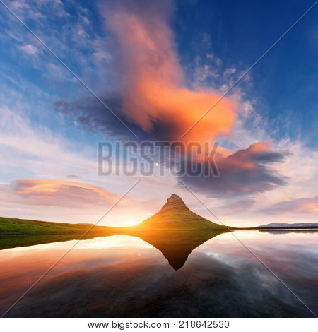 Colorful sunrise on Kirkjufellsfoss waterfall. Amazing morning scene near Kirkjufell volkano, Iceland, Europe. Landscape photography