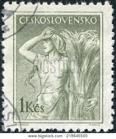 CZECHOSLOVAKIA - CIRCA 1954: A stamp printed in the Czechoslovakia shows a peasant woman circa 1954