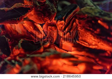 Burnig charcoals and remaining ashes with ember