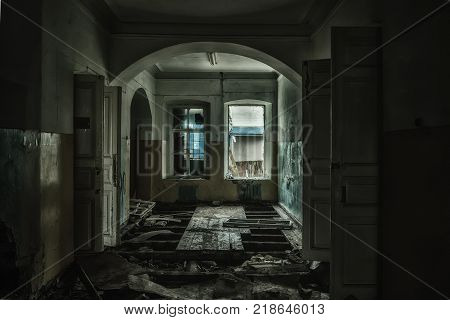 Sinister and creepy interior of abandoned and rotten hospital.