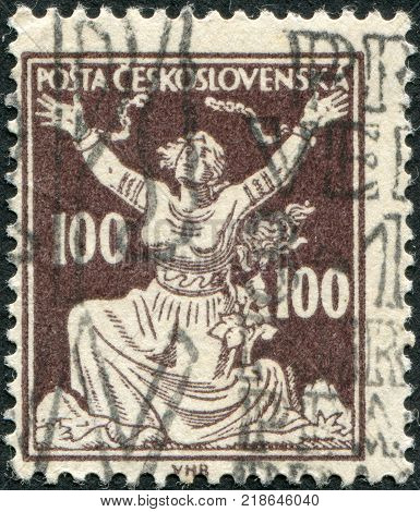 CZECHOSLOVAKIA - CIRCA 1920: A stamp printed in the Czechoslovakia shown Czechoslovakia Breaking Chains to Freedom circa 1920