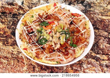 Spicy papaya salad and Spicy sour mixed herb salad with fried tofu for Chinese vegetable festival .