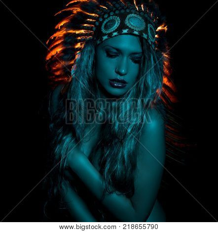 ethnic, beautiful girl with plume of american indian feathers