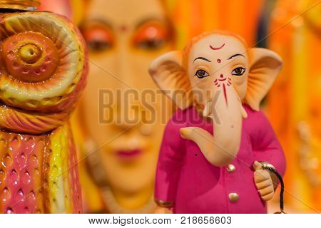 Colorful dolls made of clay Lord Ganesha handicrafts on display during the Handicraft Fair in Kolkata earlier Calcutta West Bengal India. It is the biggest handicrafts fair in Asia.