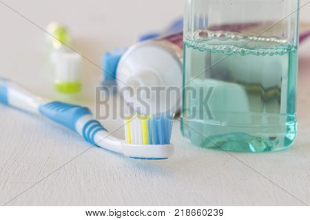 morning with clean in oral cavity and teeth toothbrush mouthwash toothpaste for healthy teeth on white