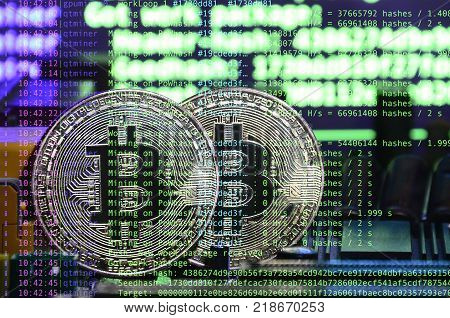 Image of the program code showing the process of mining the crypto currency in the background of the image with bitcoin