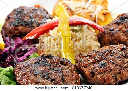 Greek Burger Plate	with rice and fried potatoes