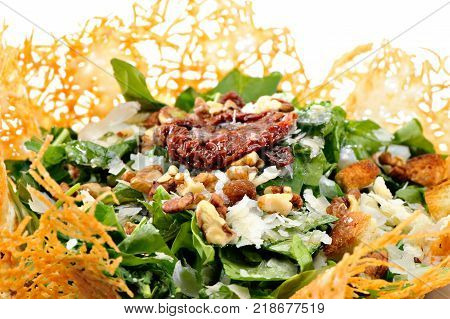 Rocca Salad with dried tomato in cheese bowl