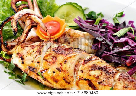 Grilled Greek Calamari with vegetables and tomatoes