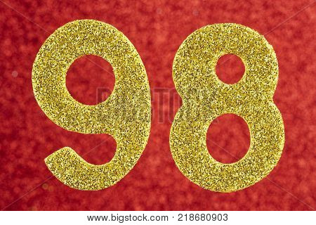 Number ninety-eight gold color over a red background. Anniversary. Horizontal