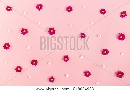 Abstract background with pattern created with tiny pink and white flowers.