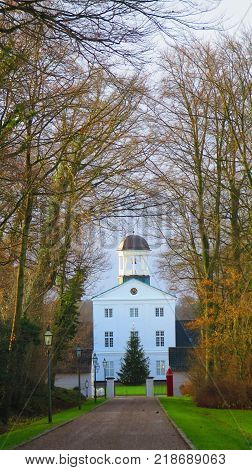 Christmas tree in front of large building at end of long drive in Graasten Southern Denmark