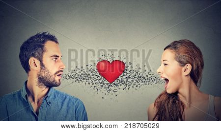 Love connection. Man woman talking to each other with red heart in-between and alphabet letters coming out of open mouth. Common language