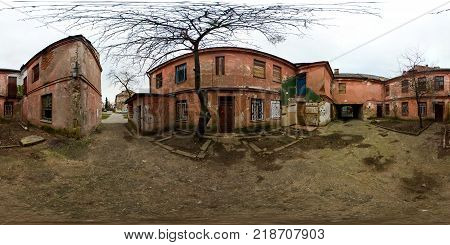 GRODNO BELARUS - SEPTEMBER 11 2012: panorama in old courtyard with houses with red walls. Full 360 degree panorama in equirectangular equidistant spherical projection skybox for VR content