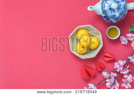 Flat lay image of items decoration & ornaments for Chinese new year and lunar holiday background concept.Difference essential accessory on the red wallpaper.object for mock up and template design.