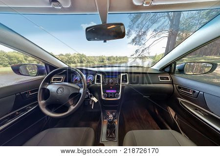 SMORGON BELARUS - NOVEMBER 24 2014: Interior of Geely Emgrand CS7 is near the river in the forest
