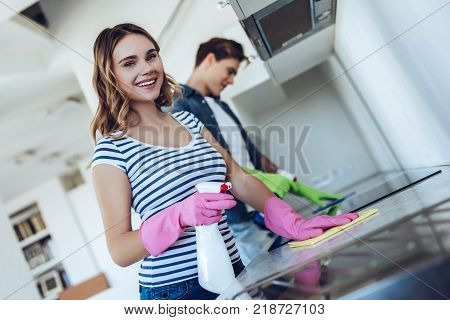 Couple Is Doing Cleaning At Home