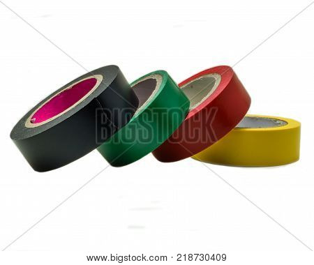 Adhesive insulation tapes are isolated on a white background. Colorful insulating tape on white background. Rolls of insulation  multicolored tape.