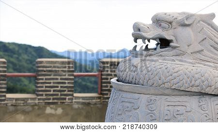 Statue Of A Dragon On The Great Wall Of China. The Great Wall Of China Which Is A White Statue Of A 