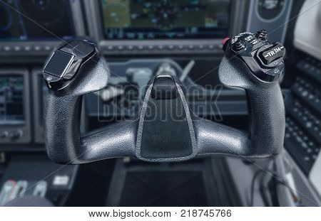 Inside the cockpit of the snall airplane. The steering wheel of the aircraft. Close up steering wheel