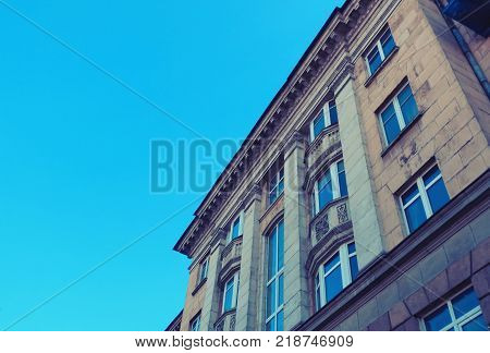 The fasade of old house at the street. Low angle view