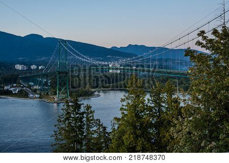 Lions Gate Bridge Sunset and evening of the beautiful town on Pacific Ocean in Vancouver Canada.