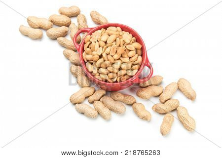 Roasted peanuts with peanut shells isolated on white background
