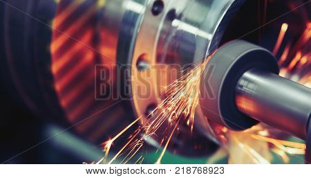 Finishing metal working on high precision grinding machine in factory