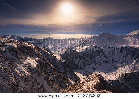 beautiful winter sunset over caucasus mountains, georgia