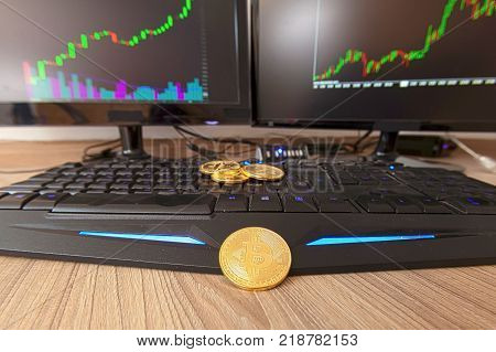Detail Of A Bitcoin Coin With A Blurred Graph In The Background.