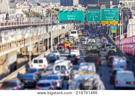 Rush hour traffic jam with cars trucks buses and taxis on the Williamsburg Bridge in Brooklyn New York City NYC