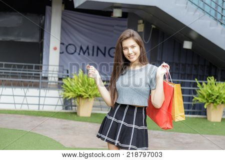 Girl Shopping In Department Store.