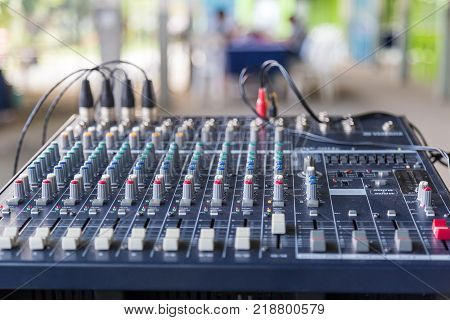 And old Equalizer mixer controller with knobs and sliders for mini event.