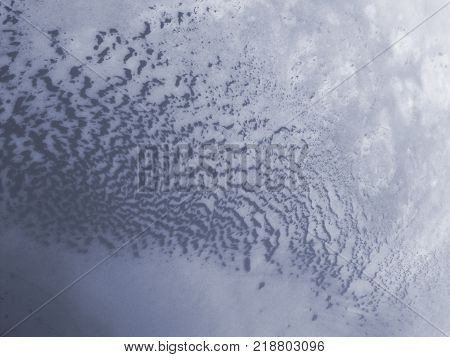 Strange patterns formed on an icy river