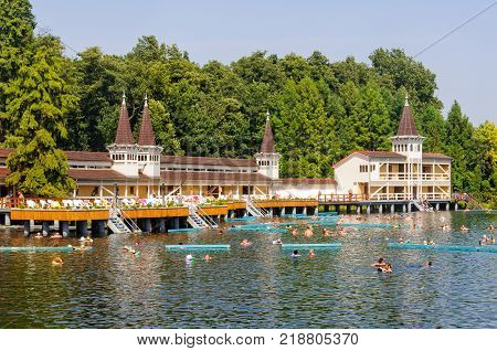 Bathers enjoy an unrivaled experience in the world's largest natural thermal lake - Heviz, Hungary, 4 September 2011