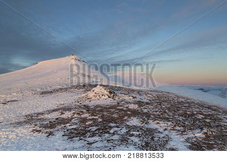 Winter snow scene at dusk on Pen y Fan mountain in the Brecon Beacons National Park, Wales
