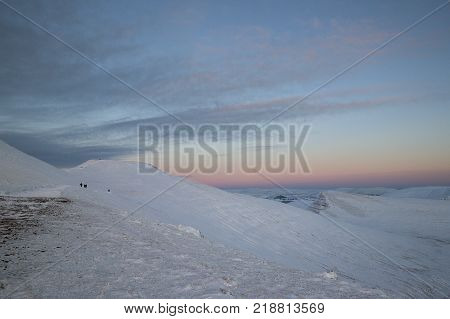 Winter snow scene at sunset on Pen y Fan mountain in the Brecon Beacons National Park, UK