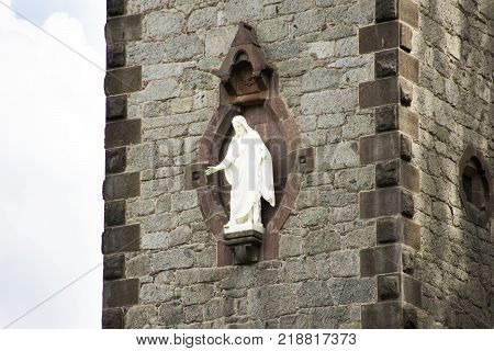 White statue jesus god on tower of Chiesa evangelica di Cristo church at walkway riverside passer river in Meran city in Merano Italy