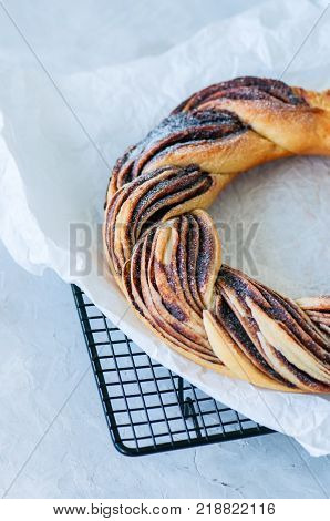 Chocolate Swirl Brioche Wreath On A White Stone Background