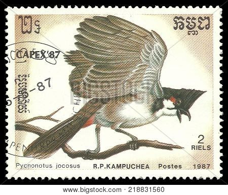 Cambodia - stamp printed 1987 Multicolor Memorable issue of offset printing Topic Birds and Philatelic Exhibitions Series Capex '87 Red Whiskered Bulbul Pycnonotus jocosus