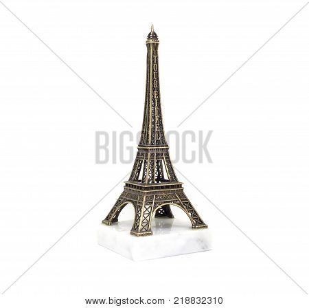 Paris Eiffel tower souvenir on the marble stand isolated on white background