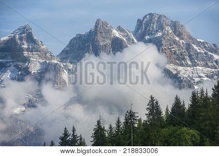 view of the steep mountain slopes covered with snow in the Swiss Alps