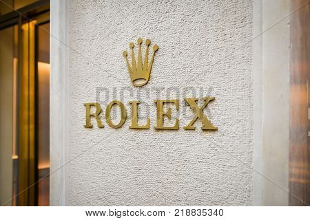 Milan Italy - September 24 2017: Rolex logo in a store in Milan. Fashion week Rolex shopping