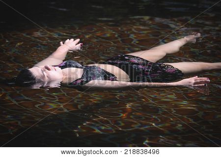 Young asian fat woman relaxing in swimming pool at spa resort,exercise and relaxing concept.